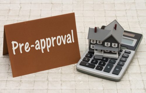 Home Mortgage Pre-approval, A Gray House, Brown Card And Calcula Home Mortgage Pre-approval A gray house brown card and calculator on stone background with text Pre-approval